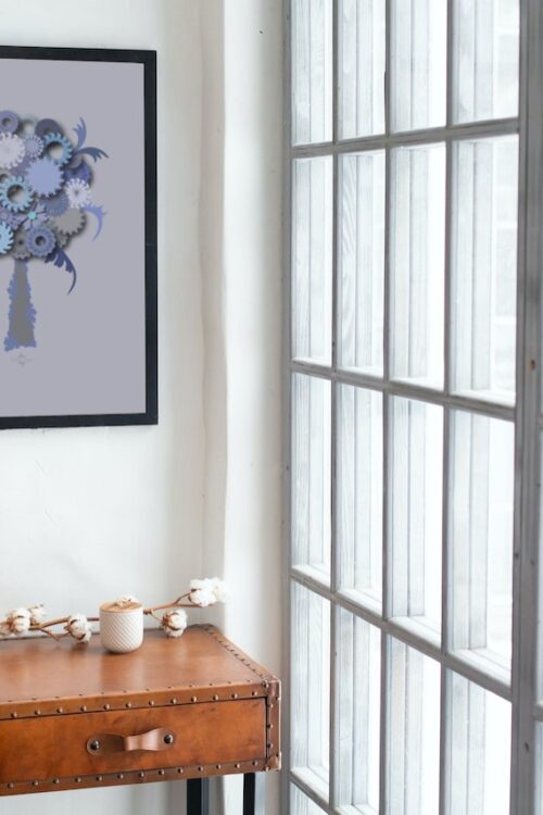 blue roud tree framed poster in a loft