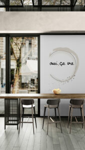 oui-ca-va-wallart-in-city-cafe-with-window-views-