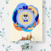 ellow Superdad Cat Poster in a Child's Room: A bright yellow poster featuring Superdad Cat hangs on a wall decorated with colorful floral wallpaper.