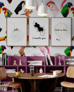 cosy room with colourful bird wallpaper and french posters gallery wall