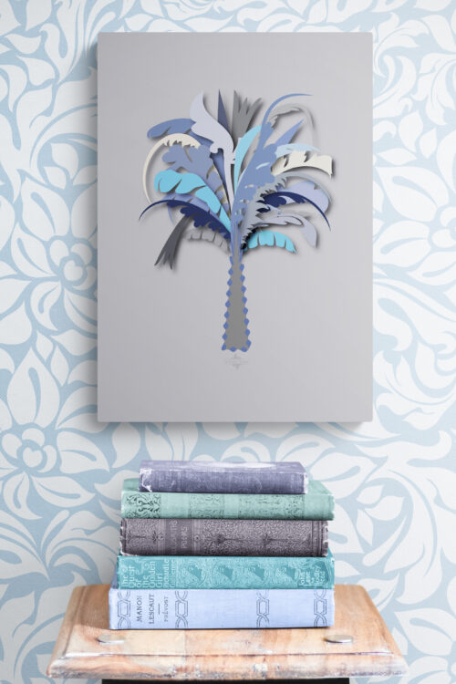 blue palm tree wall decor above stack-of-books-on-wooden-stool