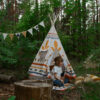 Teepee Indian Vibe in a forest with little boy