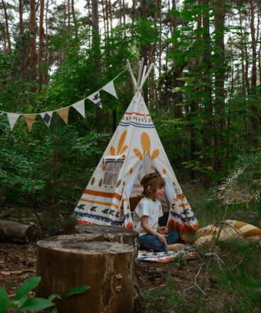 Teepee Indian Vibe in a forest with little boy