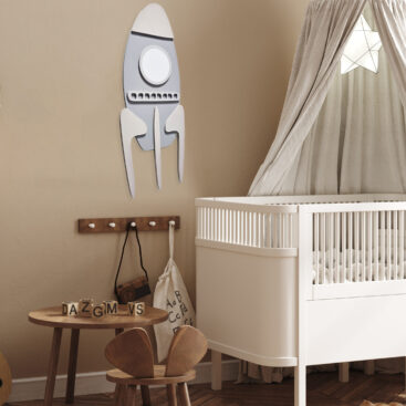 the rocket wall decor for kids room in a nursery
