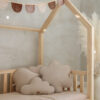 Soft, delicate and subtle pillows arrangment in a house bed for kids - the floral pillow, the cloud pillow, the leaf pillow