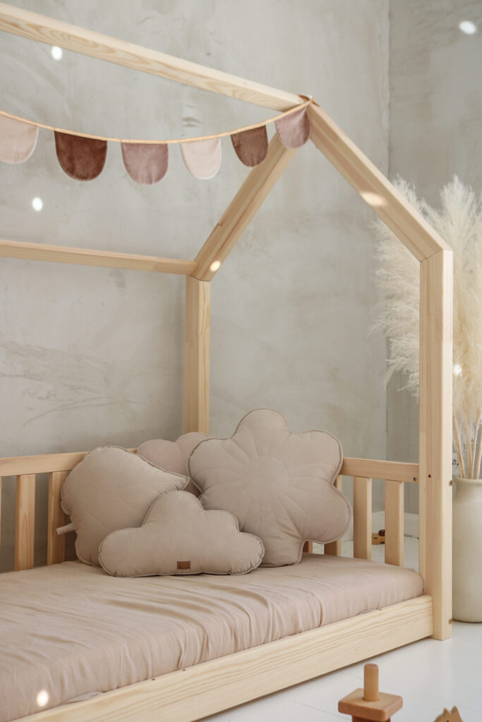 Soft, delicate and subtle pillows arrangment in a house bed for kids - the floral pillow, the cloud pillow, the leaf pillow