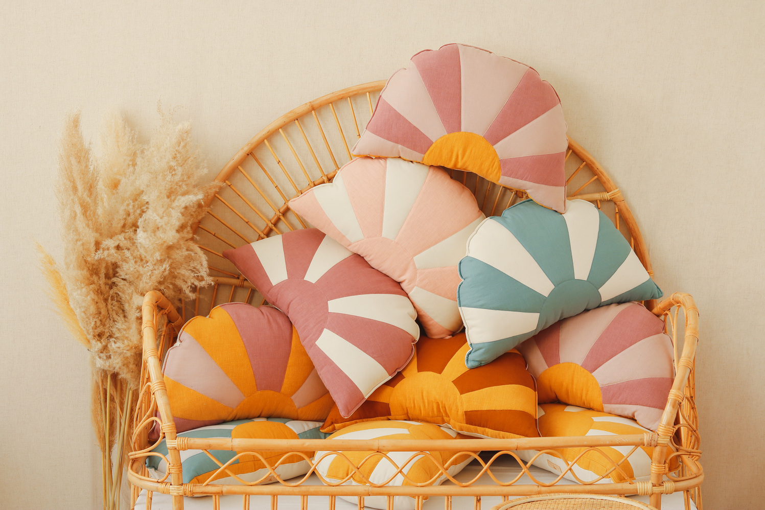 comfortable and solid sun pillow collections in blue white orange and pink white and red and orange on a wicker chair