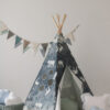 night sky teepee tent in dark navy with grey cloud pillow and white shell pillow and grey leaf mat