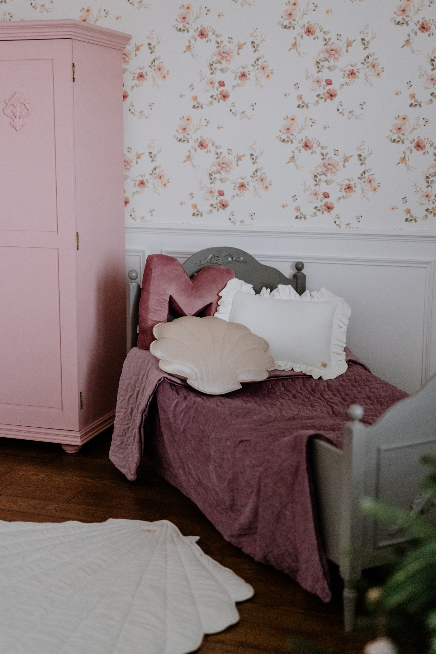 Velvet Pillow with Frills – White in a girls room with floral wallpaper