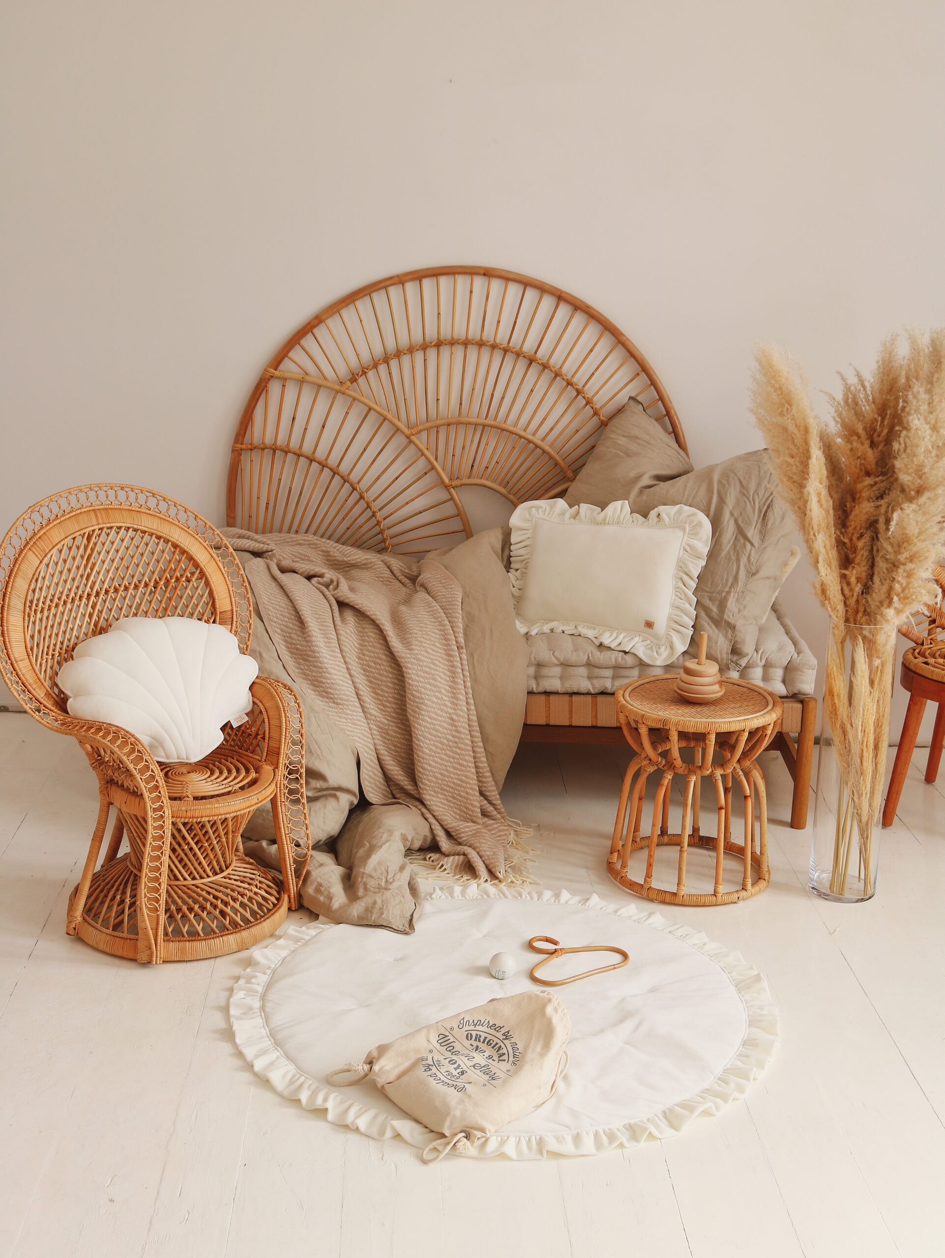 Velvet Pillow with Frills – White in neutral, beige space with wicker furniture