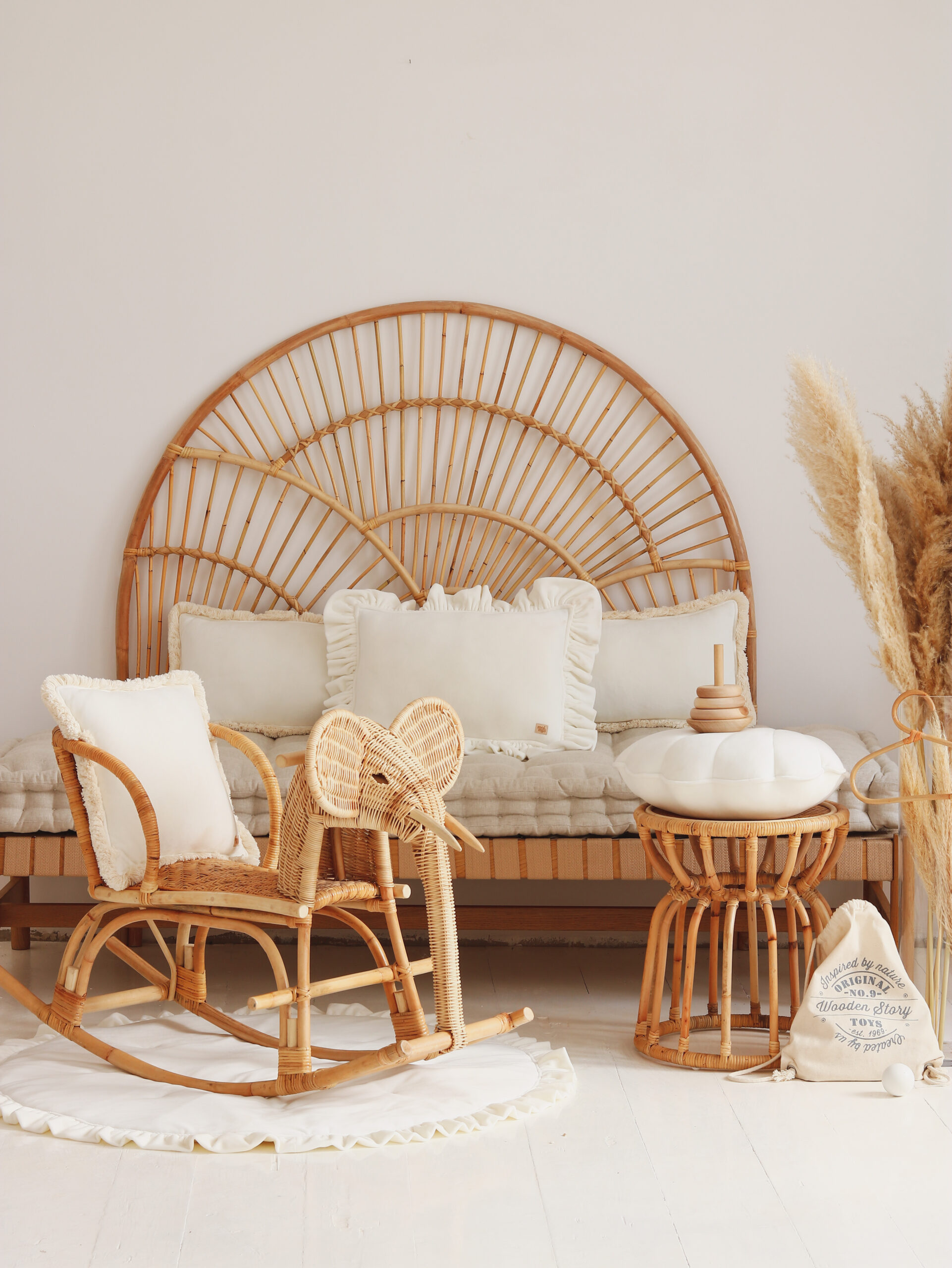 Velvet Pillow with Frills – White in neutral, beige space with wicker furniture