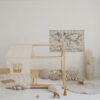 raw cotton bed canopy over house bed in neutral, beige kids room