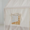 raw cotton bed canopy over house bed - window opening