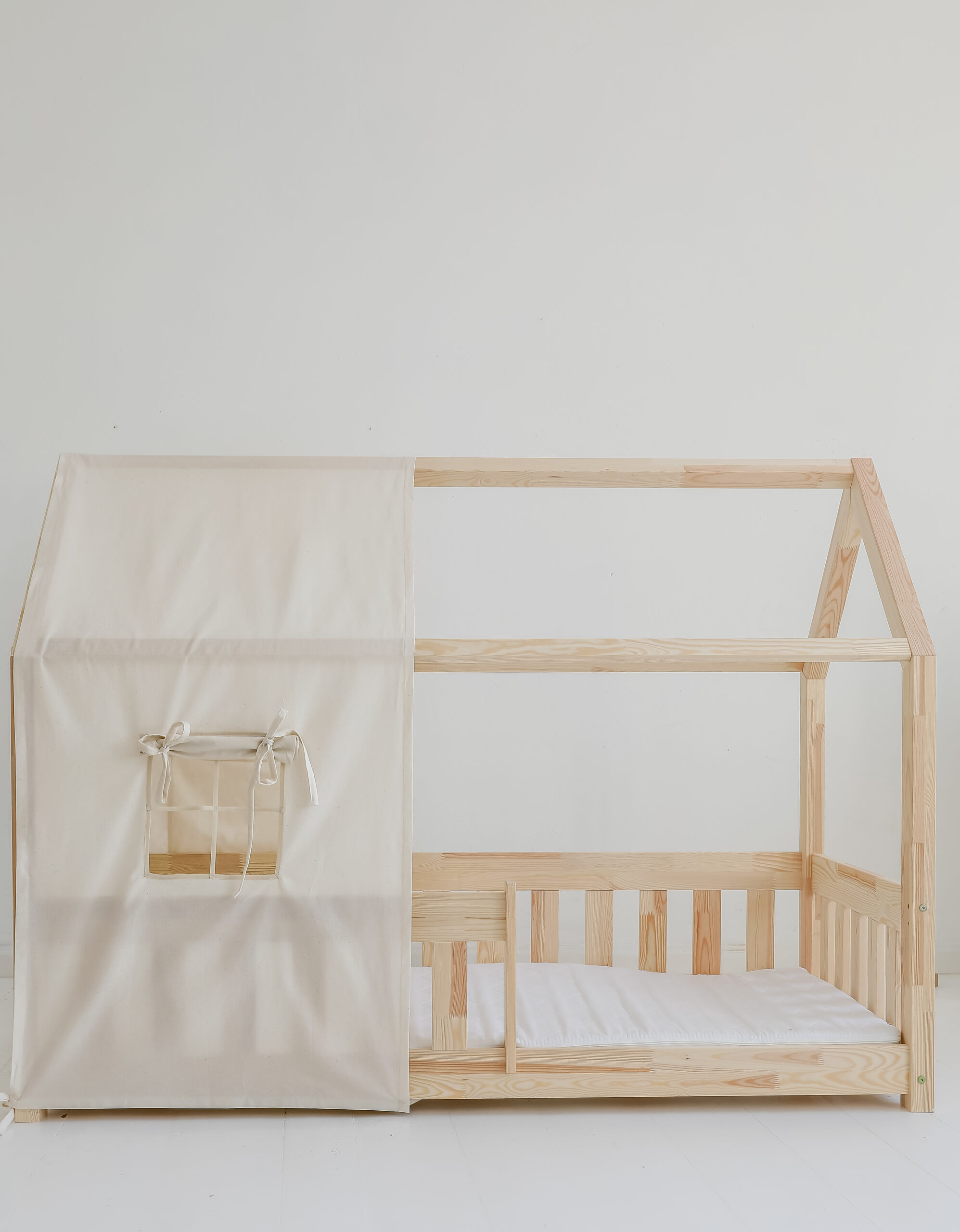 raw cotton bed canopy over house bed, neutral and raw