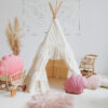 shabby chic teepee tent in neutral space and pink pillows
