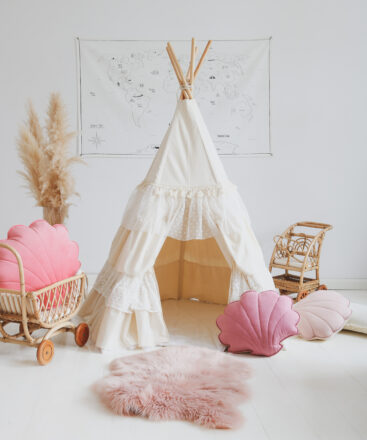shabby chic teepee tent in neutral space and pink pillows
