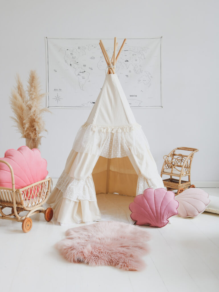 shabby chic teepee tent in neutral space and pink pillows