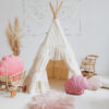 shabby chic teepee tent in neutral space and pink pillows