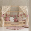 elver garland stars - pink in a pink styled bed canopy